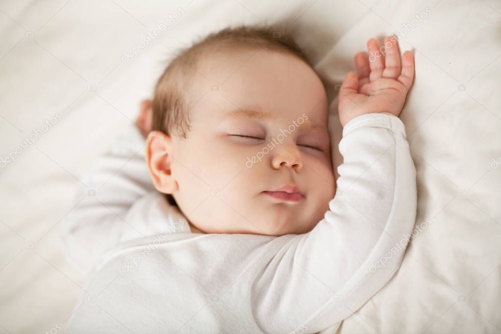 Sleeping newborn baby on white background. Small sleeping child,