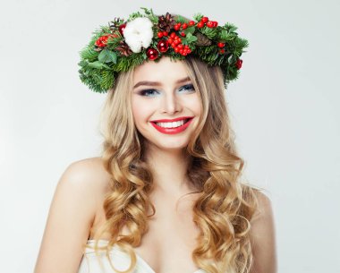Beautiful happy woman with Christmas garland smiling on white