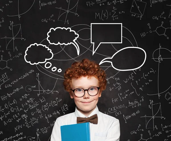 Diligent child boy with empty bubble clouds on chalkboard — Stock Photo, Image