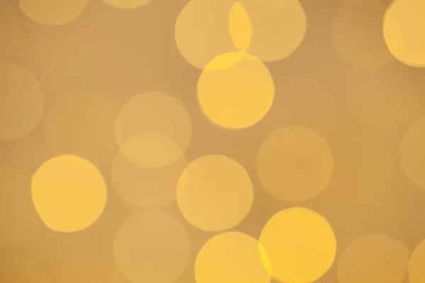 Fondo de luz bokeh amarillo cálido — Foto de Stock