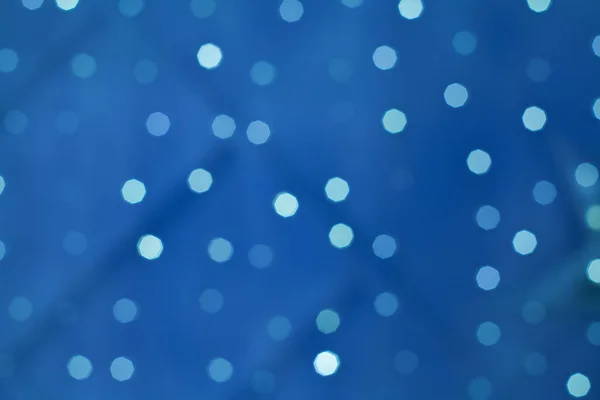 Bokeh Licht in der Nacht auf blauem Hintergrund — Stockfoto