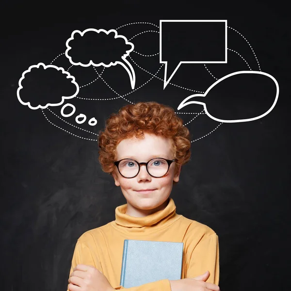 Redhead boy in glasses and empty speech clouds bubbles — Stock Photo, Image