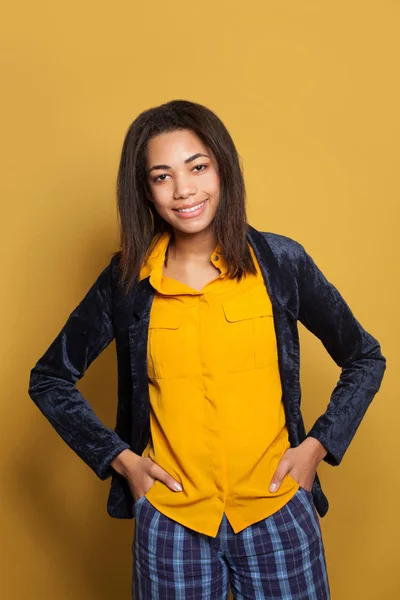 Happy cheerful young woman student in yellow shirt and blue blazer portrait — 스톡 사진