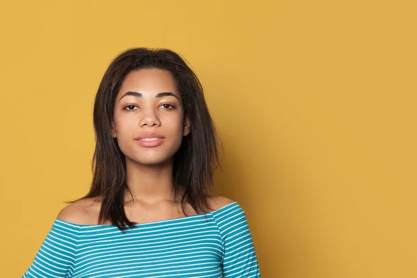 Beautiful African American woman on yellow background — 스톡 사진