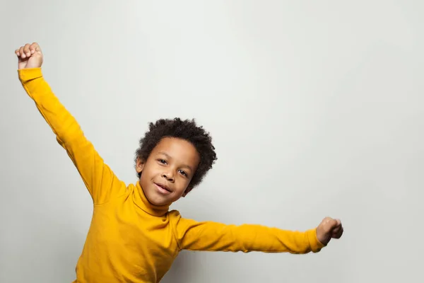 Playful African American child boy on white background — 스톡 사진