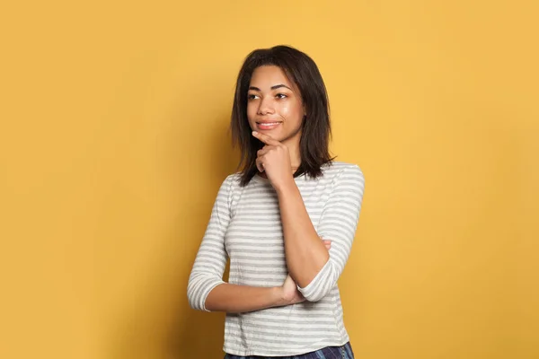 Happy Young Black Woman Thinking Yellow Background — 스톡 사진
