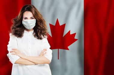 Kanada bayrağına karşı maskeli doktor ya da virolog. Grip salgını ve virüs koruma kavramı