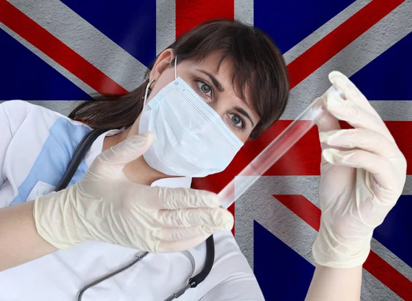 Scientist woman with test tube Coronavirus or COVID-19 against Great Britain flag. Research of viruses in laboratory for prevention of a pandemic in Great Britain