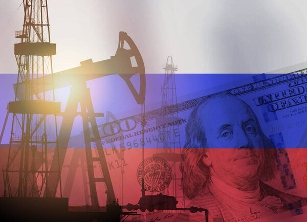 Pump jack, US dollar notes and Russia flag background. Crude oil and petroleum concep
