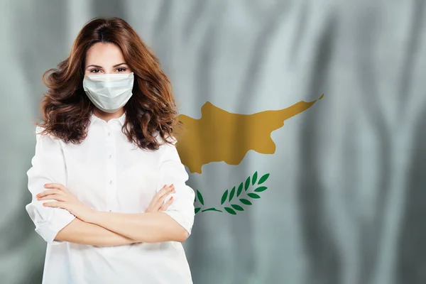 Doctor or nurse in medical safety face mask on Cypriot flag background. Flu epidemic and virus protection in Cyprus concept