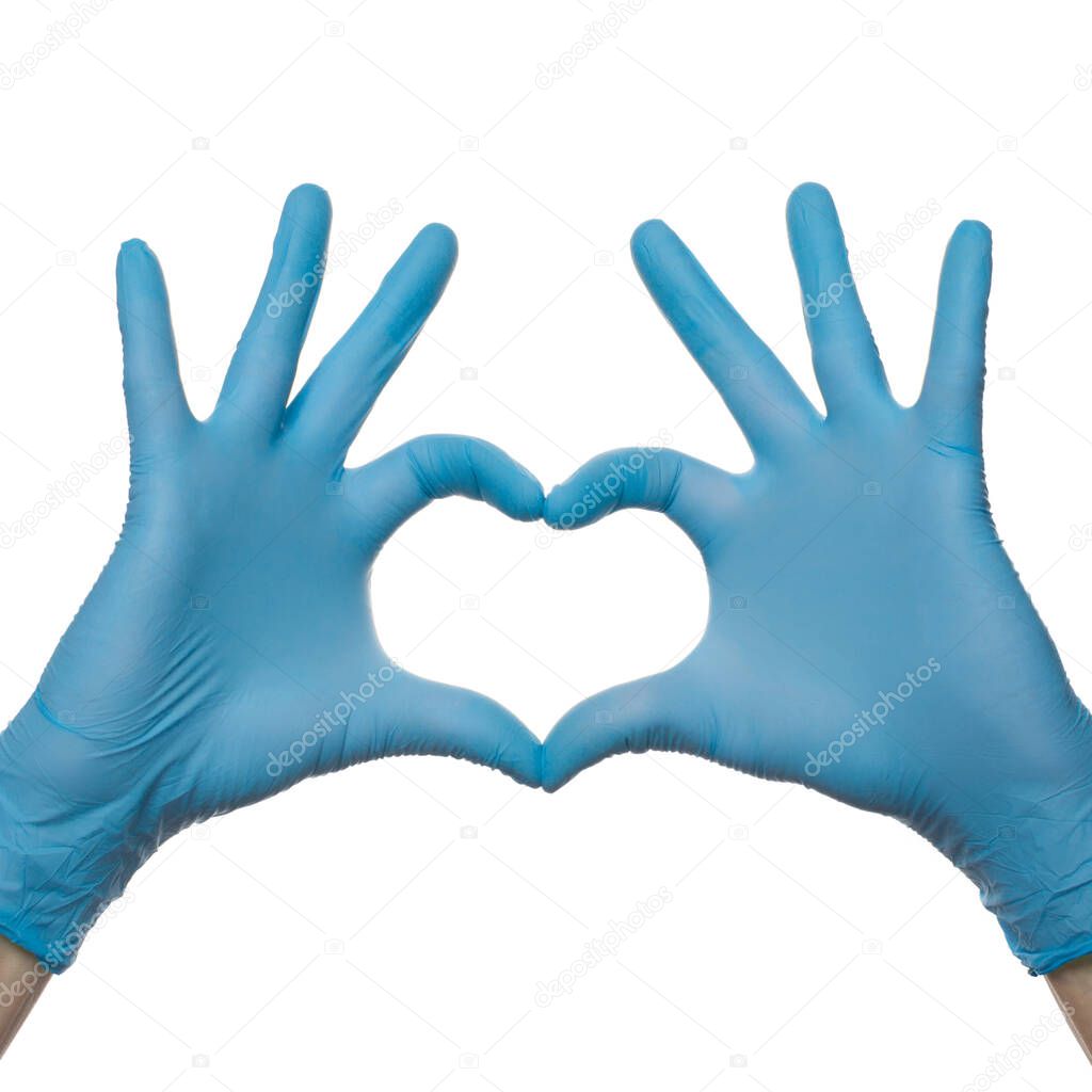 Medical gloves. The heart from doctors hands in medical gloves isolated on white background