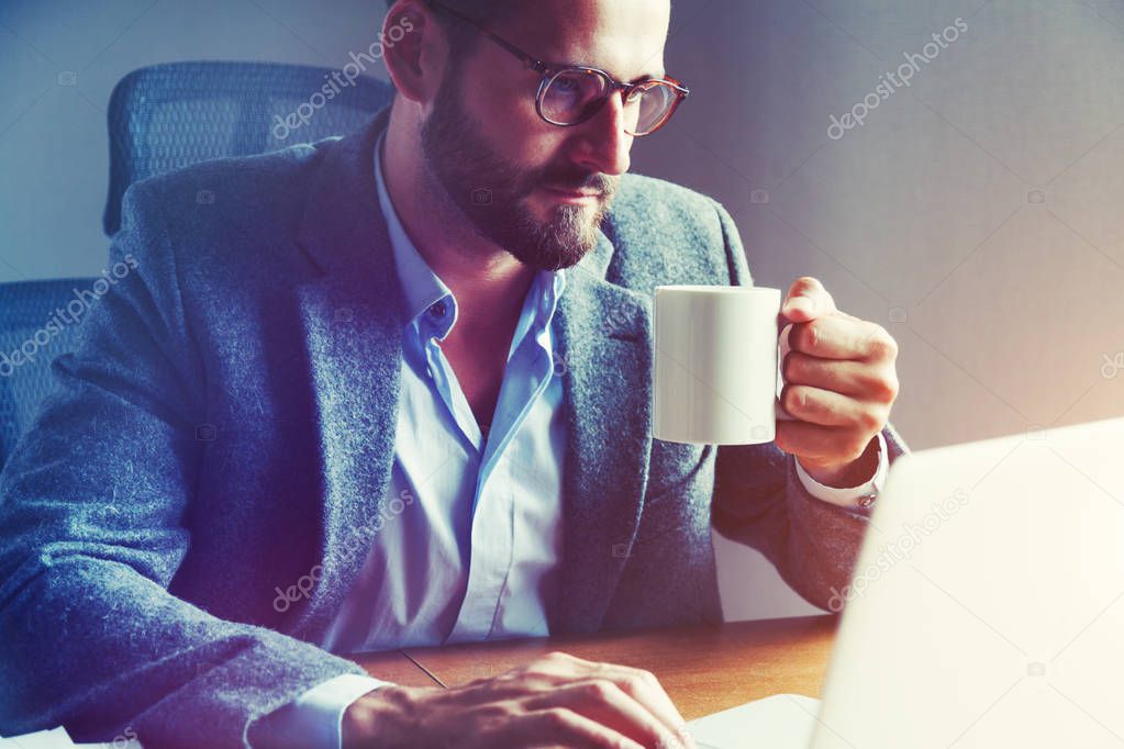 businessman drinking cup of morning coffee
