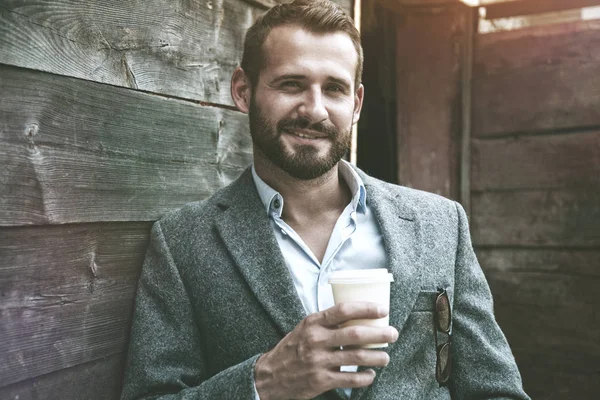 Businessman having paper cup of coffee — Stock Photo, Image