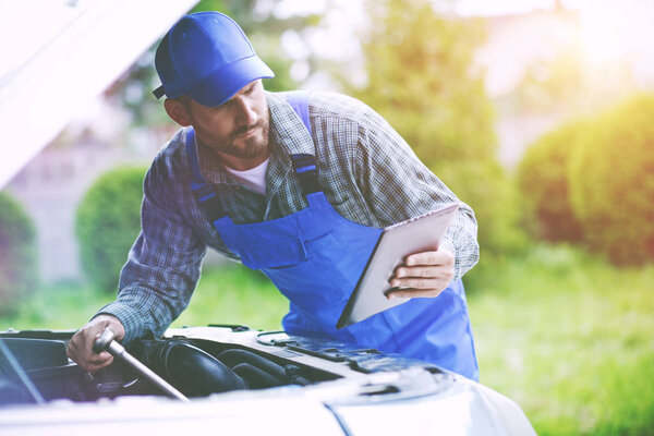  mechanic working with digital tablet