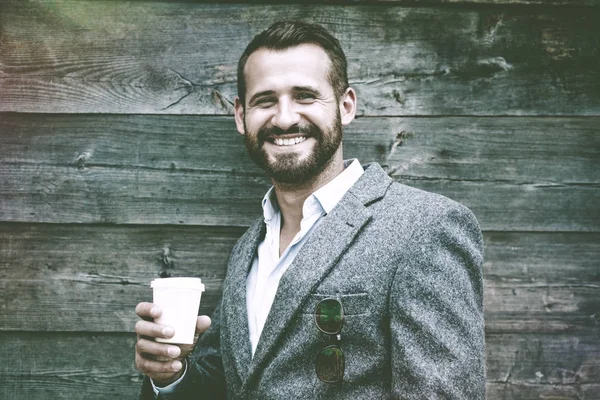 Businessman holding morning paper cup — Stock Photo, Image