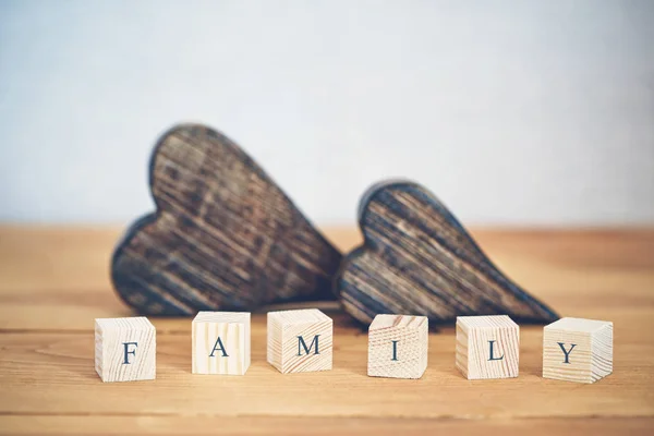 Two Wooden Hearts Family Word Written Blocks — Stock Photo, Image