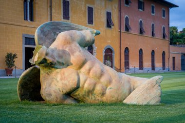 Fallen angel sculpture at Pisa central square, close view