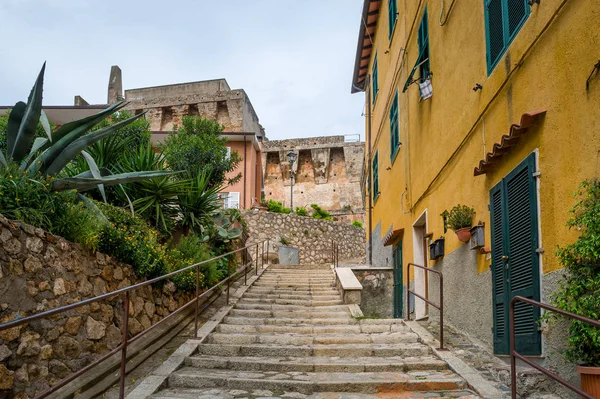 Santo Stefano street going uphill to fortress walls Fotos De Bancos De Imagens
