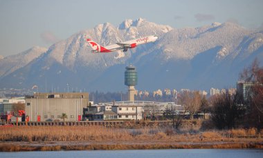 Air Canada Jet leaves Vancouver International Airport clipart
