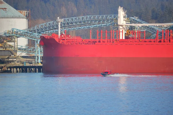 Giant Carrier and Small Speed Boat — Stock Photo, Image