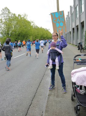 Mother and Baby at Sun Run in Vancouver, Canada clipart