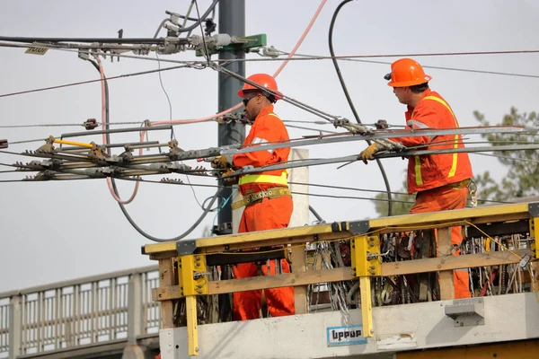 Multi Racial Hydro Crew Work Together Overhead Power Lines Stand — Stock Photo, Image