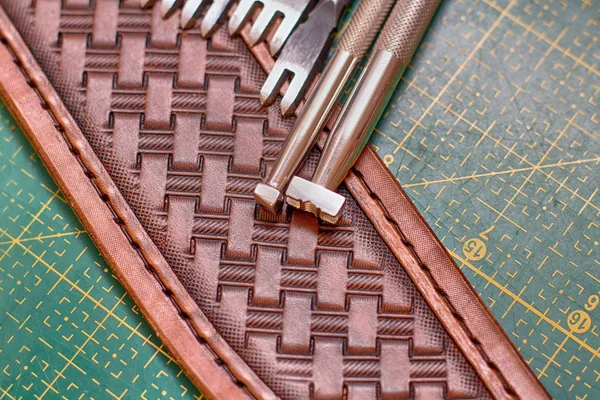 making stamping on leather with handtools