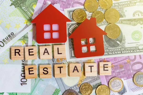 word text real estate or buy on the money banknotes background