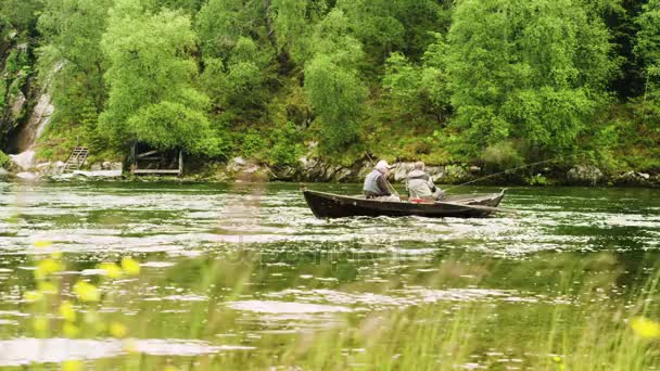 Senior men fishing from boat — Stock Video