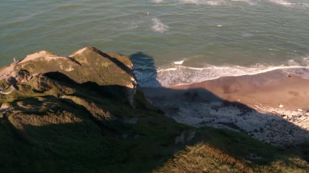 Drone over cliff to sea — Stock Video