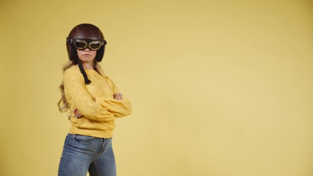 Confident Blonde Woman Standing with Arms Crossed, Wearing a Motorcycle Helmet — Stock Video