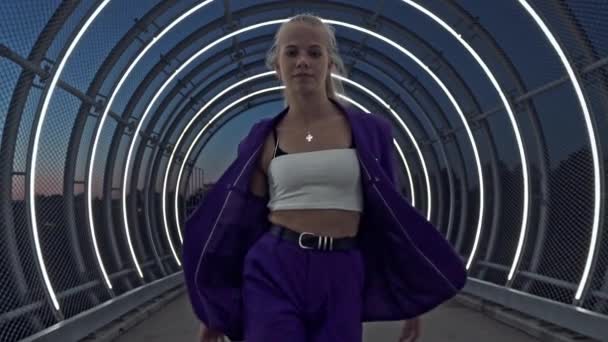 Young Performer Walks then Dances Along the Open Tunnel Surrounded by Lights — Stock Video