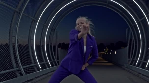 Slow Motion Shot of Blonde Female Performer Passionately Dancing in an Open Tunnel — Stock Video