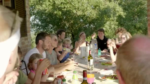 A Happy Family Toasting during a Family Dinner, Tuscany. — Stok video
