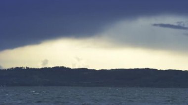 Breathtaking View of the Vast Ocean and Dark Clouds Clearing Up