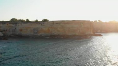 Beautiful Wavy Waters Splashing Against the Bottom of Cliff