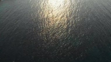 Serene Blue Waters and Sunlight Reflection