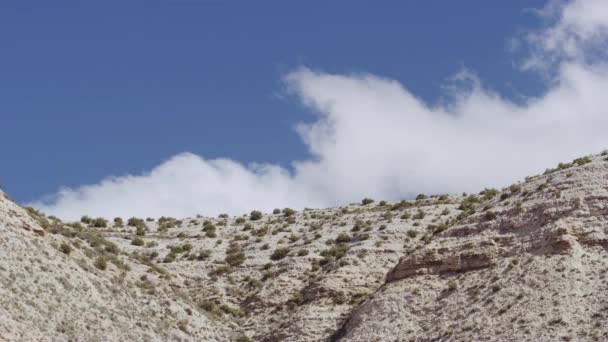 Tilted Angled Shot of Mountain Peak and White Clouds in Background — Stok video