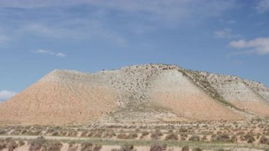 Timelapse Shot of Thin Clouds Rolling Above Mountain in Spain