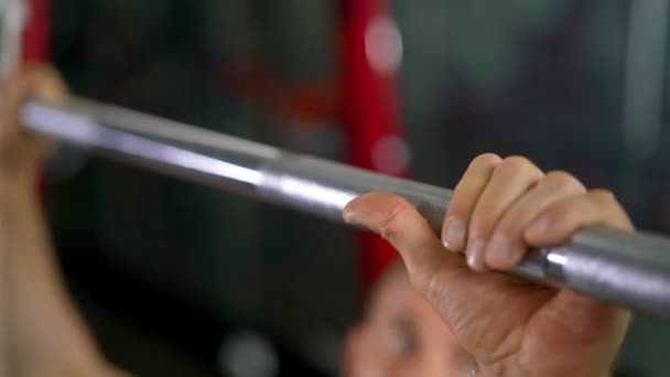 Focused Shot of Man's Hands Holding the Barbell Bar for a Bench Press — Stock Video