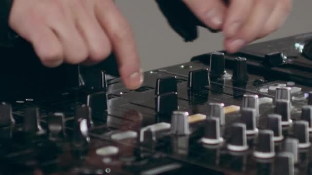 Dj Moving Controls On Mixing Desk — Stockvideo