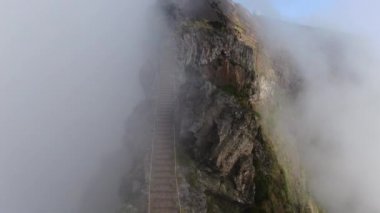 Staircase On Mist Covered Mountain Top