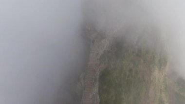 Man Descending Staircase On Misty Mountain