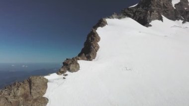Majestic Drone View of Snow Capped Peaks in Switzerland