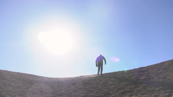 Man Walking Through Moon Like Location Of Stones And Gravel — Stock video