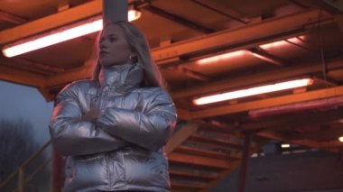 Teenage Blond Girl In Silver Puffer Jacket