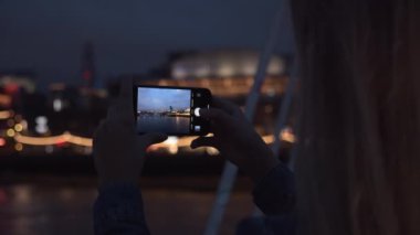 Teenage Tourist Filming With Smartphone Over City