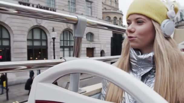 Blond Teenage Girl Dancing With Headphones On Bus — Stok video