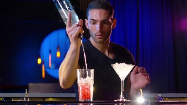 Handsome Male Bartender in Black Performs Some Flaring Tricks — Stock Video