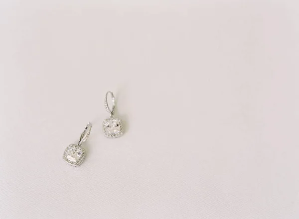 Precious earrings with gems — Stock Photo, Image